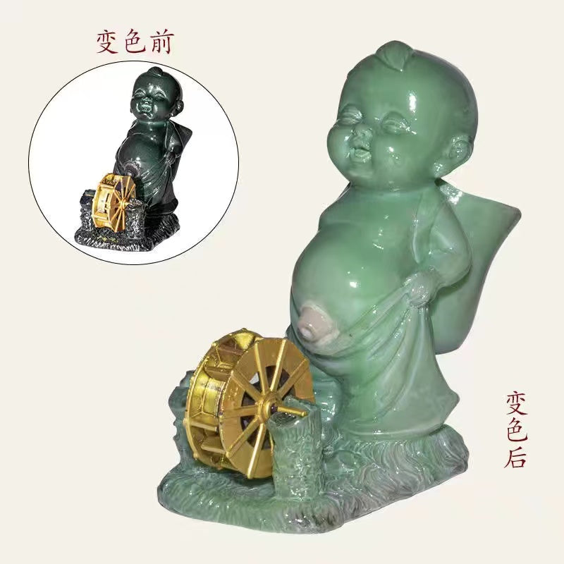 Pissing child with a spinning wheel color changing tea pet