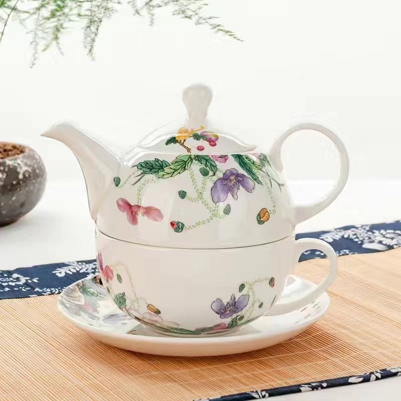 A bird and flower cup and a jug and a jug of water